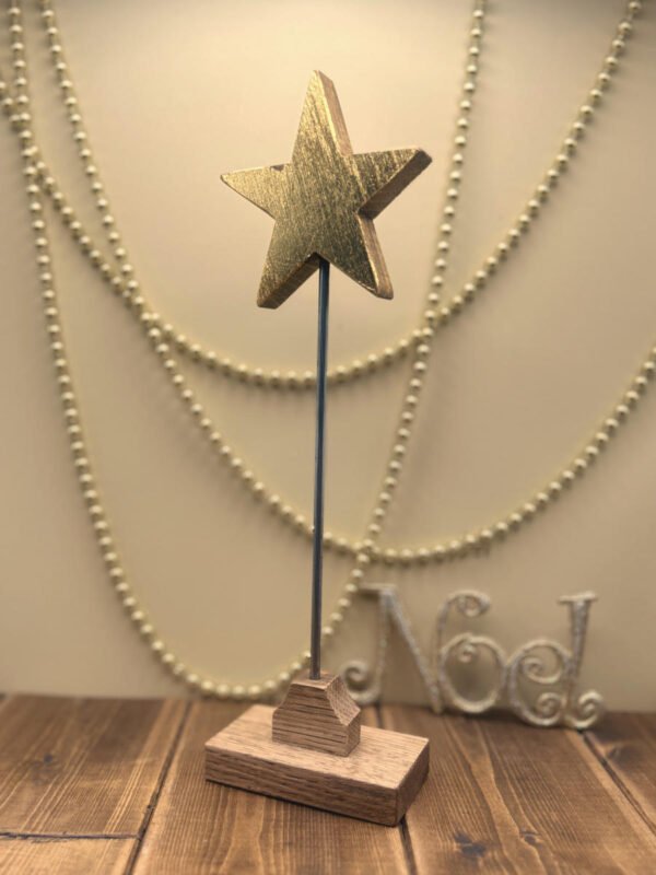 A floating Christmas Star made from Oak and finished in gold leaf