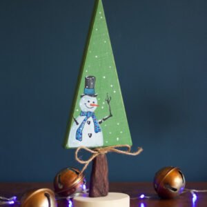 A wooden Christmas ornament featuring an hand-painted snowman