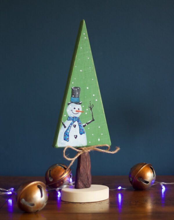 A wooden Christmas ornament featuring an hand-painted snowman