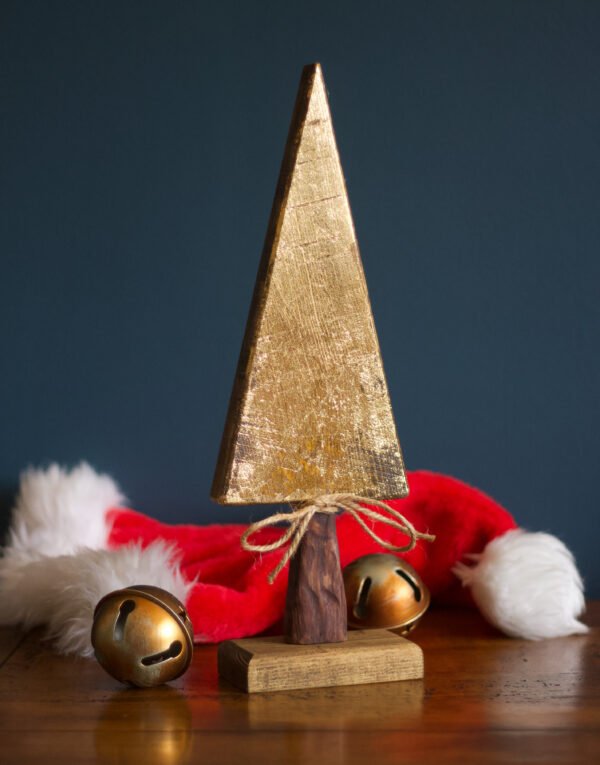 A wooden tree ornament with a gold leaf finish