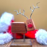 A quirky reindeer decoration made from wood.