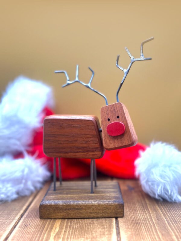 A quirky reindeer decoration made from wood.