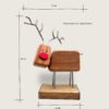A reindeer decoration with product dimensions
