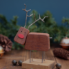 A chunky reindeer Christmas decoration made from hardwood and steel.