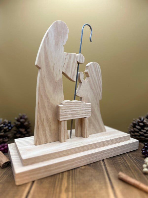 A nativity scene with Joseph, Mary and Baby Jesus made form Ash.