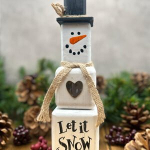 A rustic Snowman ornament made from wooden blocks