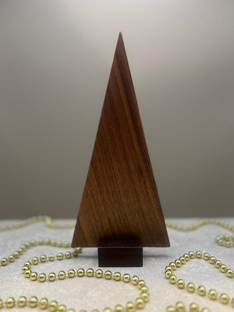 A contemporary tree ornament made from walnut.