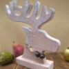 A Reindeer decoration featuring head and antler is a Limed Oak finish.