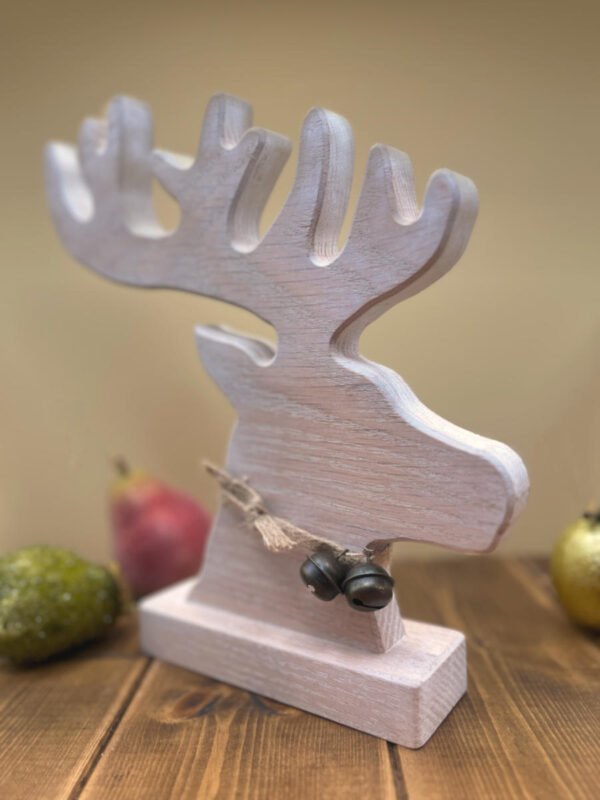 A Reindeer decoration featuring head and antler is a Limed Oak finish.
